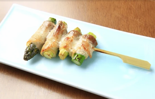 Asparagus skewers wrapped in meat