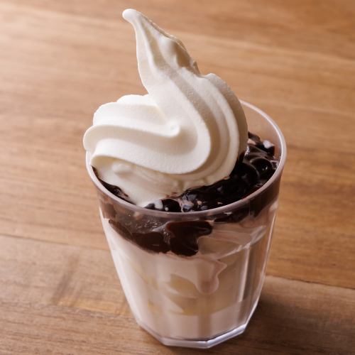 Soft serve ice cream with chocolate sauce