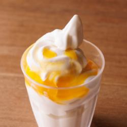 Soft serve ice cream with mango sauce