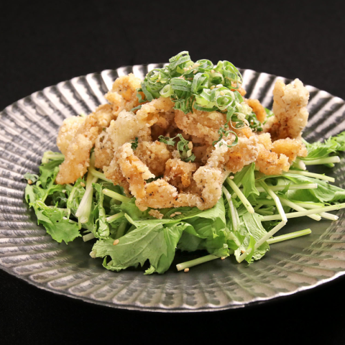 Crispy ponzu sauce with chicken skin and mizuna