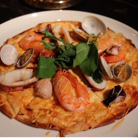 Pizza with seafood, tomato and Americane sauce
