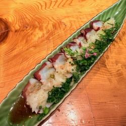 Local octopus carpaccio with green onions and salt