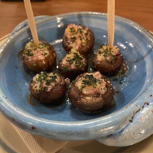 Grilled mushrooms stuffed with prosciutto