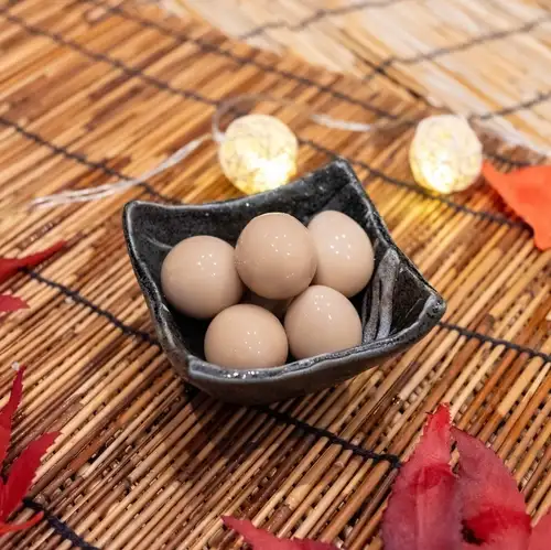 Quail eggs marinated in sauce