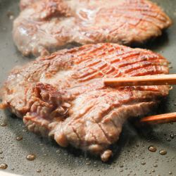 Thickly sliced grilled beef tongue