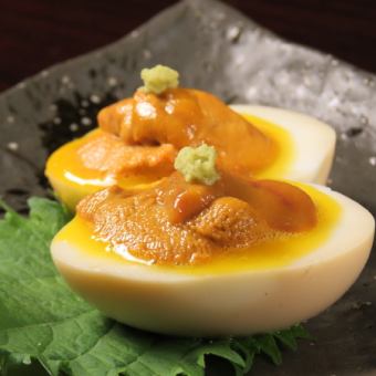 Sea urchin on the boiled egg Sea urchin, sea urchin sauce, oyster soy sauce, wasabi on top of homemade boiled egg