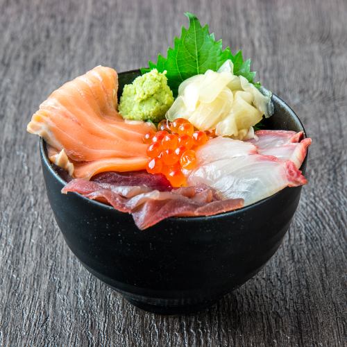 Bowl of rice topped with sashimi