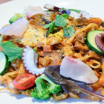 Tomato cream pasta with seafood and local vegetables