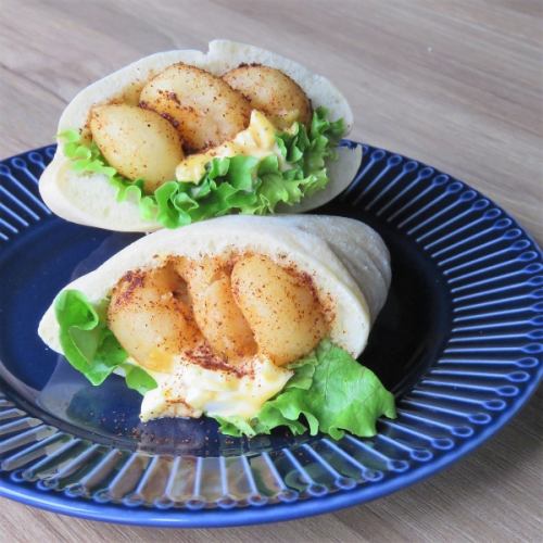 Shrimp fritter tartar pita sandwich