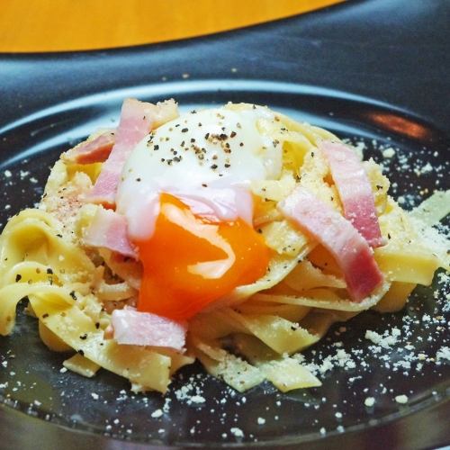 Carbonara with rich sauce, cheese and hot spring egg