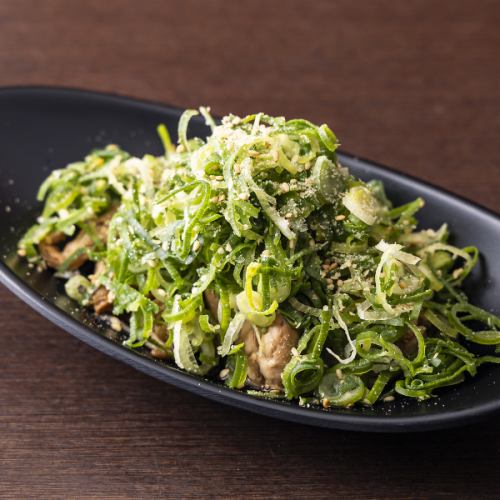 Chicken neck covered in ponzu sauce and green onions