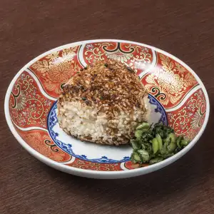 Grilled rice ball with secret sauce, featuring a raw egg/grated yam.