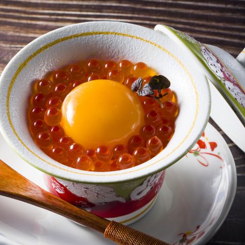 A warm and cozy steamed egg custard with egg yolk and salmon roe