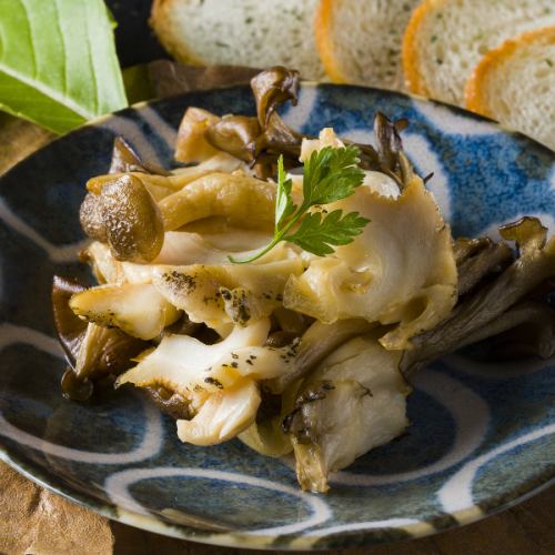 Grilled whelks and mushrooms with garlic butter