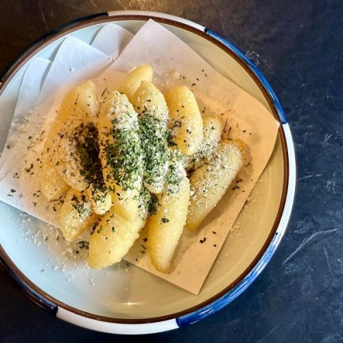 Crispy French fries topped with herb cheese