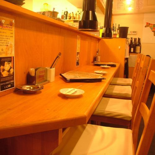 It is a counter seat near the meat bar.