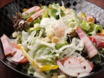 Caesar salad with soft-boiled egg and thick-sliced bacon