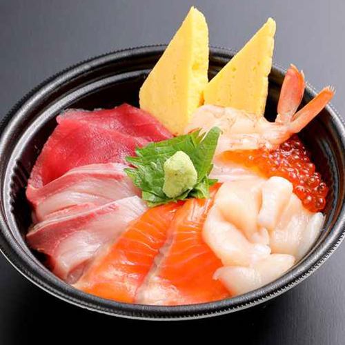 Bowl of rice topped with sashimi