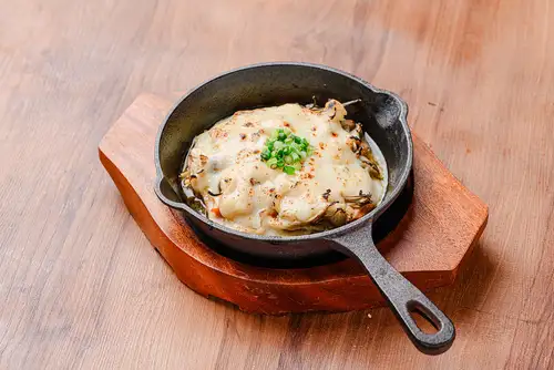 Seasonal, gooey cheese gratin