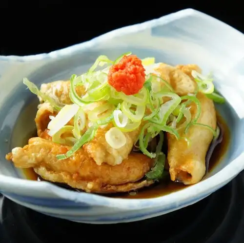 Chicken skin dumplings with green onion and ponzu sauce