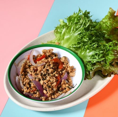 Stir-fried minced chicken gapao (wrapped in leaves)