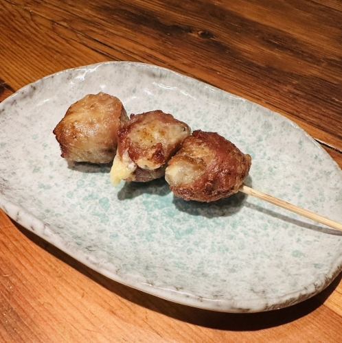 Broccoli and cheese wrapped in pork skewers