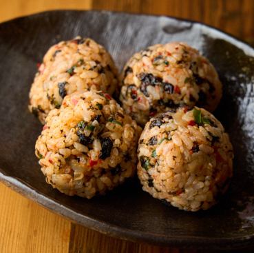 Four small rice balls with changja (spicy fermented seafood) and Korean seaweed.
