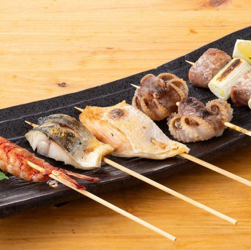 什錦海鮮串（蝦子、蔥花藍鰭鮪魚、鮭魚肚、鯖魚、章魚）