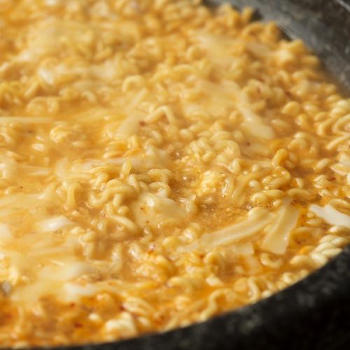 To finish, combine dried noodles called Sari noodles with eggs, soup stock, and cheese ...