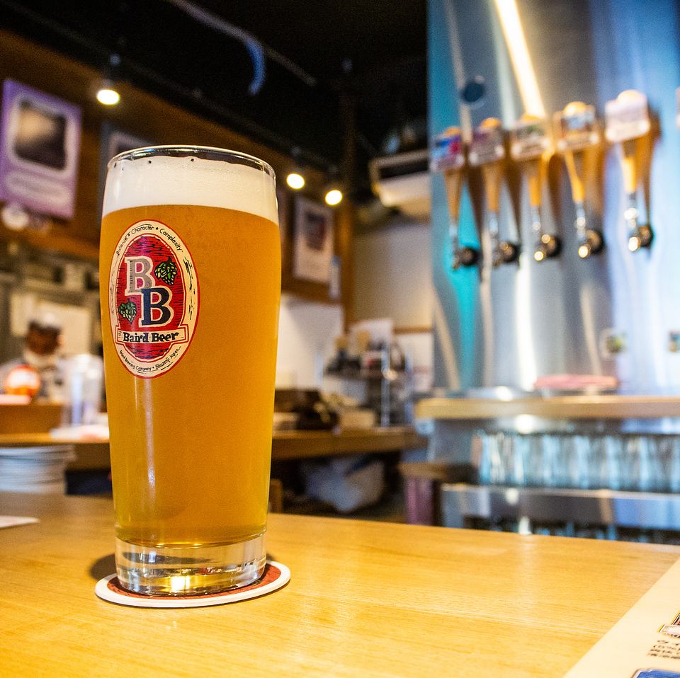 BairdBeer, made by a genius in the beer world, is served in a warm, wood-grained space.