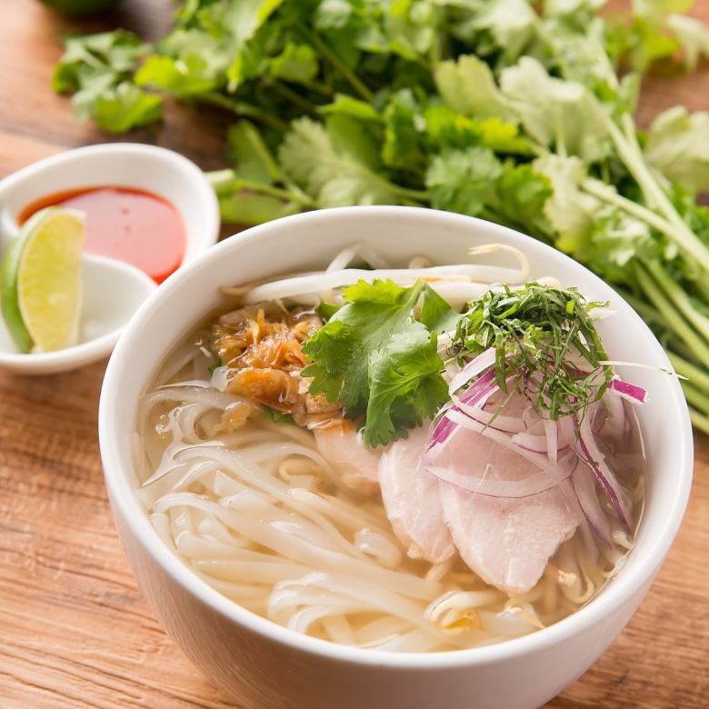 Vietnamese pho with chicken and fresh herbs