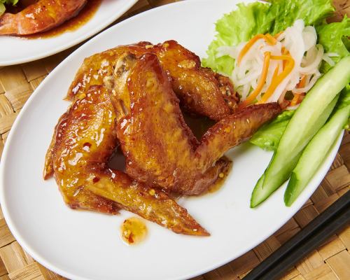 3 pieces of grilled chicken wings with nuoc mam