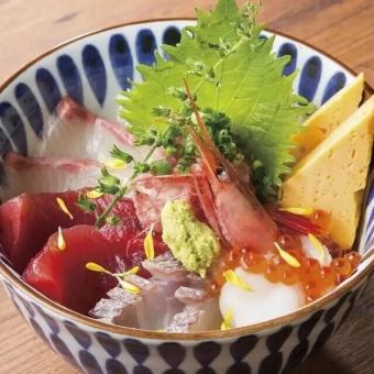 Bowl of rice topped with sashimi