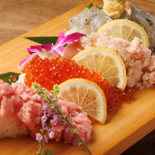 Luxurious salmon roe, tuna, crab, and whitebait overflowing sushi