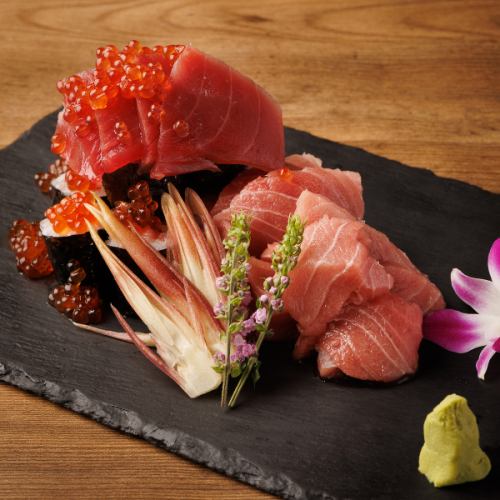 Medium fatty tuna, bluefin tuna, and salmon roe overflowing sushi