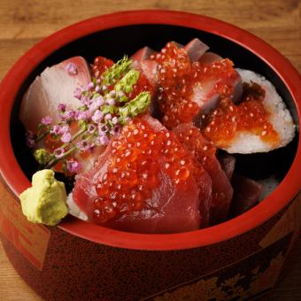 Thick roll of tuna, yellowtail and salmon roe