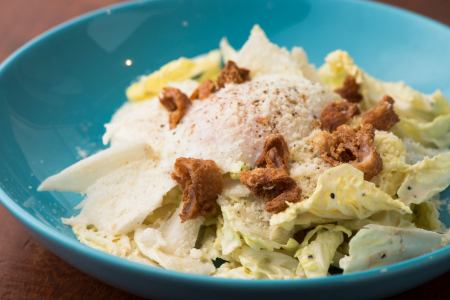 Caesar salad with crispy chicken skin and Chinese cabbage