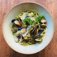 Genovese soup with white clams, clams, mussels, mushrooms, and potatoes