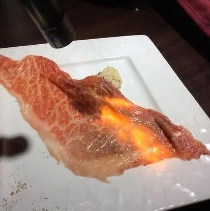 Grilled Kagoshima A4 Kuroge Wagyu beef thigh with rock salt and wasabi