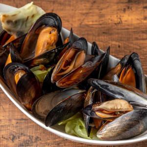 A huge serving of mussels and clams steamed in white wine