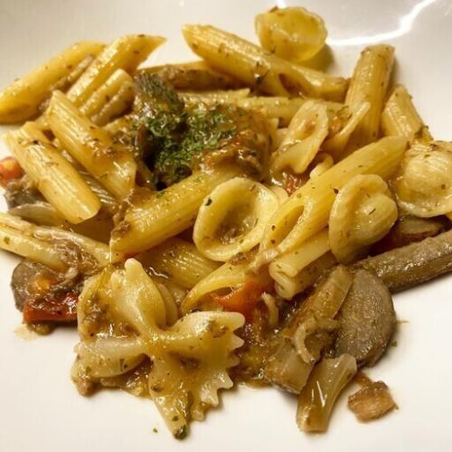 Herb-scented mussels and spring vegetables in anchovy butter short pasta