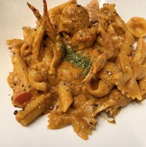 Short pasta with crab in tomato cream sauce