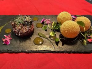 Hokkaido beef tartare with sea urchin sauce and freshly picked Manganji pepper puree