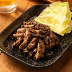 Grilled chicken over charcoal