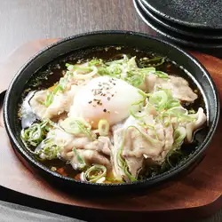 Grilled Agu pork with a soft-boiled egg on top