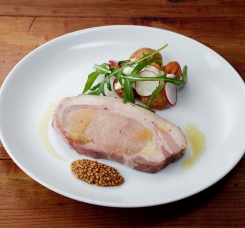 Grilled pork loin seasoned with herbs and served with mustard
