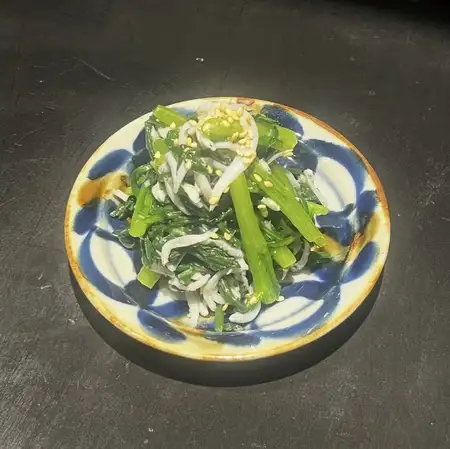 Whitebait and chrysanthemum greens with olive dressing