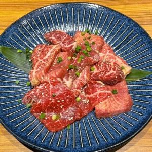 Large serving of various cuts of meat