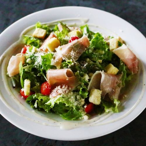 Caesar salad with prosciutto and cherry tomatoes