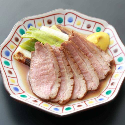 Charcoal-grilled duck and green onions